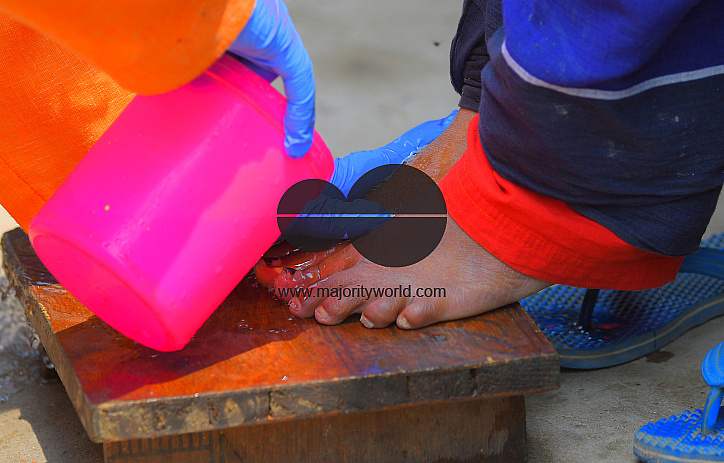 Cleaning the feet of safari workers (Cleaning Staff)