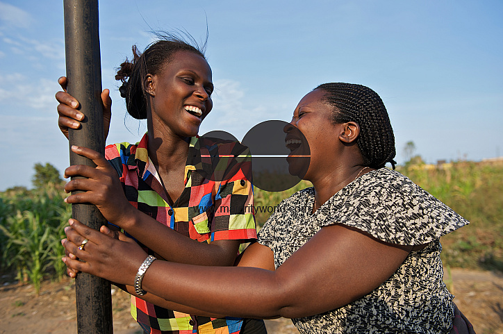  Two adolescent girls laugh
