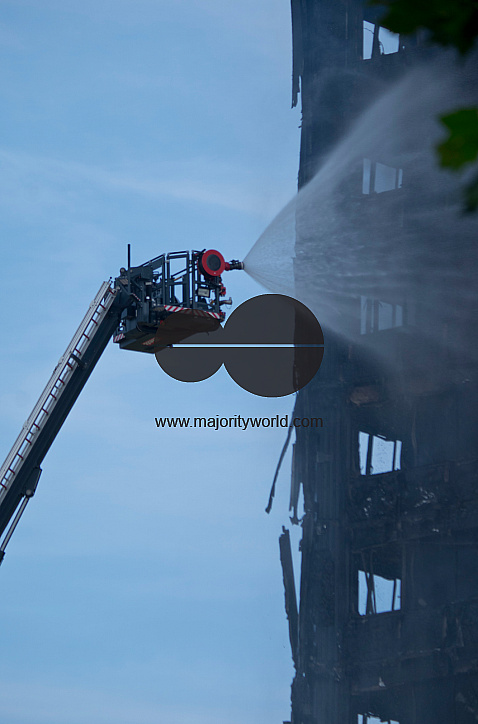 Fire brigade and community groups helping with fire disaster at  of Grenfell Tower in West London,UK