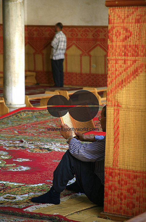 A man reading from the Quran in a mosque in Fez, Morocco. October 2, 2006.
