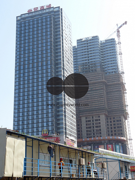 CHINA Migrant workers' temporary accomodation during construction of office blocks in Xiamen in Fujian province.