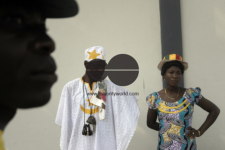 Traditional healer Gbeko Agnhenuh Ajeoda and his wife outside the Accra football stadium.