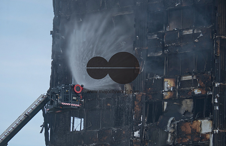 Fire brigade and community groups helping with fire disaster at  of Grenfell Tower in West London,UK