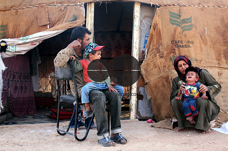 Photo story - Abu Mohammad and His family - the relationships between a poor family how they live.