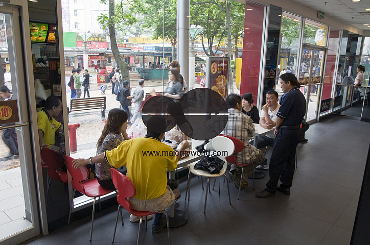 CHINA Local people eating inside a KFC fast food restaurant in Guangzhou, Guangdong province.