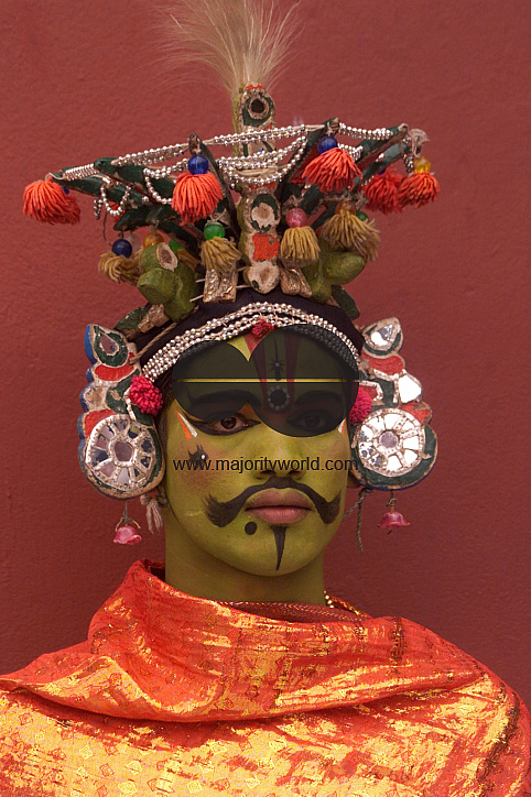 A South Indian dancer stands before a stage show at a dance festival in Kolkata