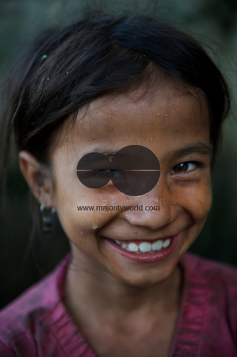  Saru Saud (7 years old) smiles standing at a water point