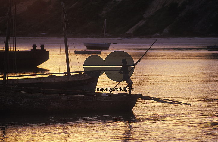 Young boy docking a boat
