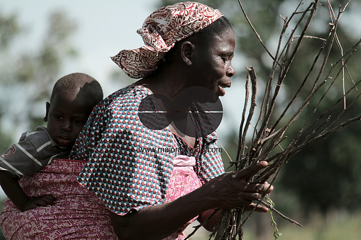 An internally displaced grandmother woman, who lost her husband to attacks from Boko Haram, gathers