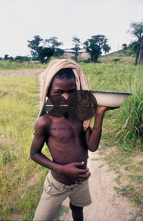 Young boy carrying food