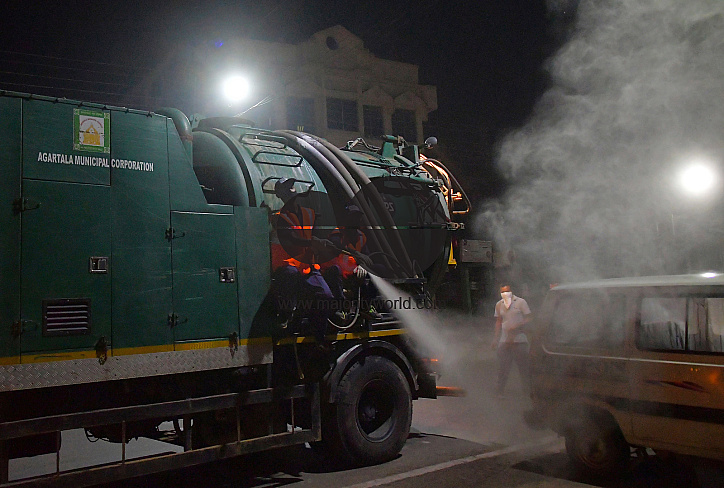 Workers Spray Disinfectant to Contain Coronavirus