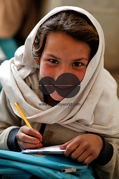  Amina (8 years old) who works at a nearby brick kiln writes in her textbook