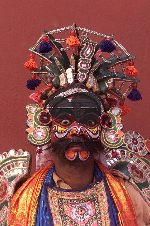 A South Indian dancer stands before a stage show at a dance festival in Kolkata