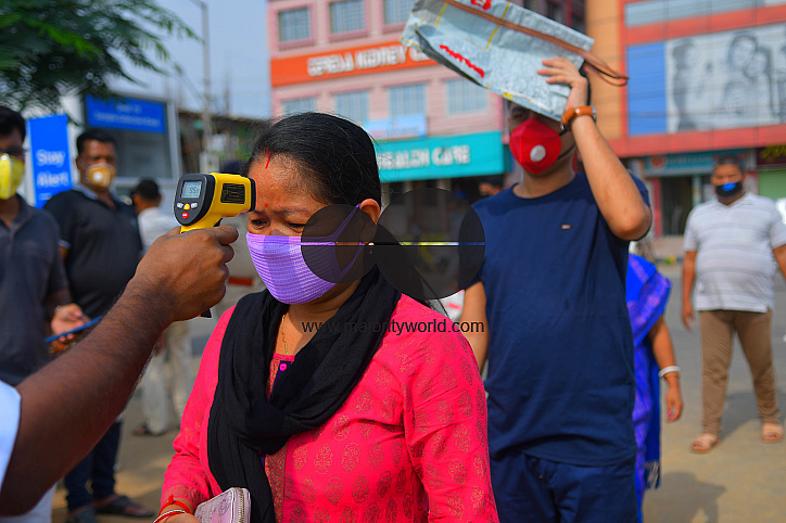 The health workers are applying infrared thermometer to check the temperatures