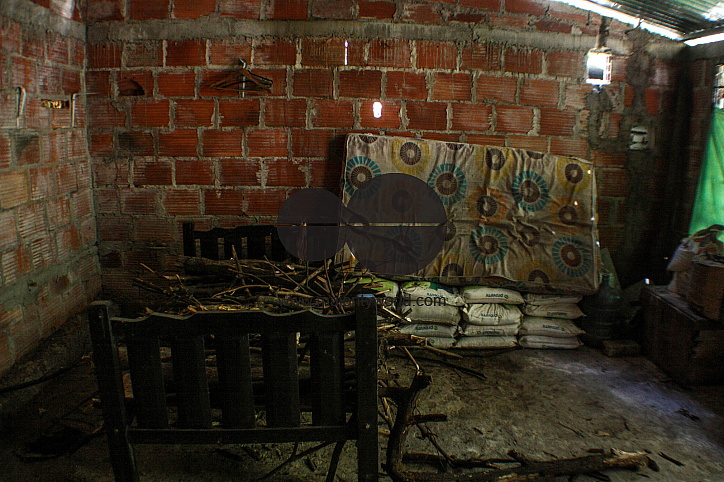 Empty bed, ruined house