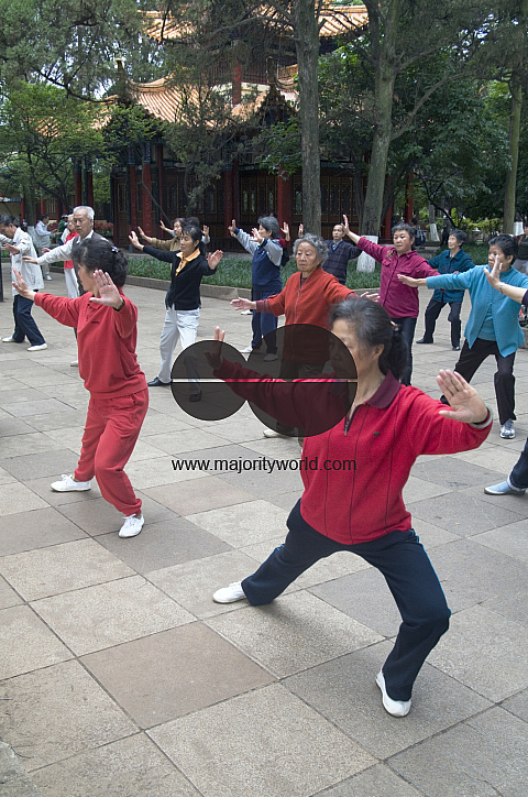 CHINA Elderly people practicing Tai Chi and other martial arts in a park in Kunming, Yunnan province..