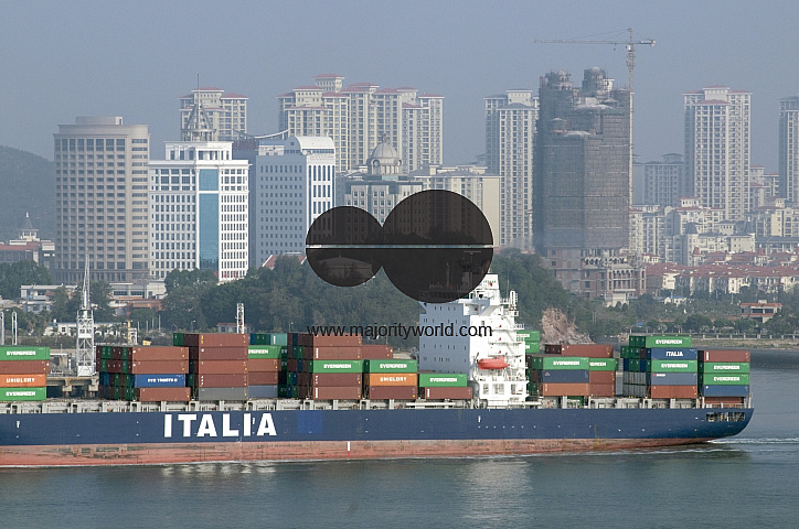 CHINA European ships half-loaded with containers, due to recession, leaving Xiamen harbour, Fujian province.