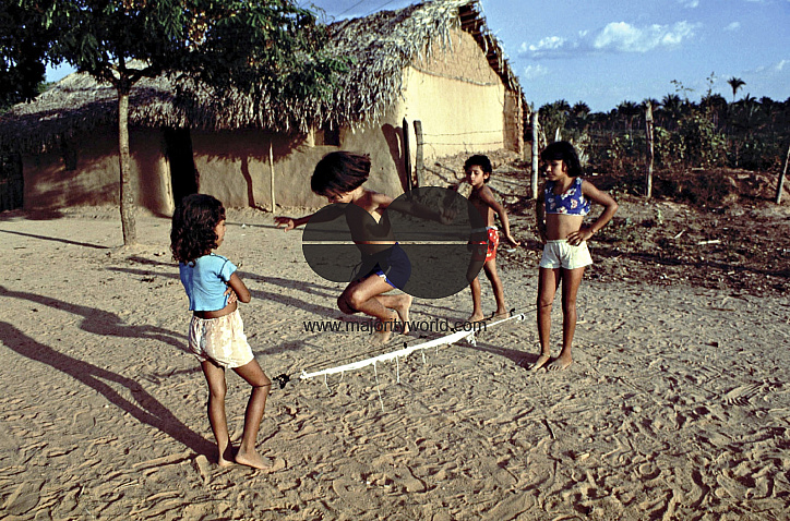 BRAZIL GIRLS SKIPPING A ROPE IN A LANDLESS PEASANT SETTLEMENT. MARANHAO STATE. Photo ¬© Julio Etchart