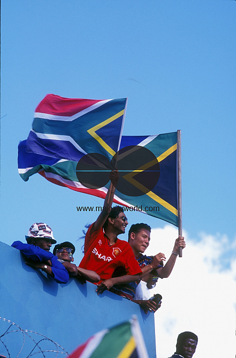 Waving the South African flag at a sports event