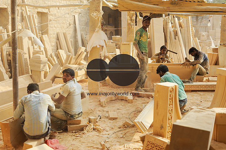  Craftsmen working in a sandstone workshop.