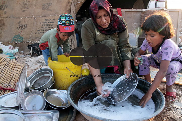 Photo story - Abu Mohammad and His family - the relationships between a poor family how they live.
