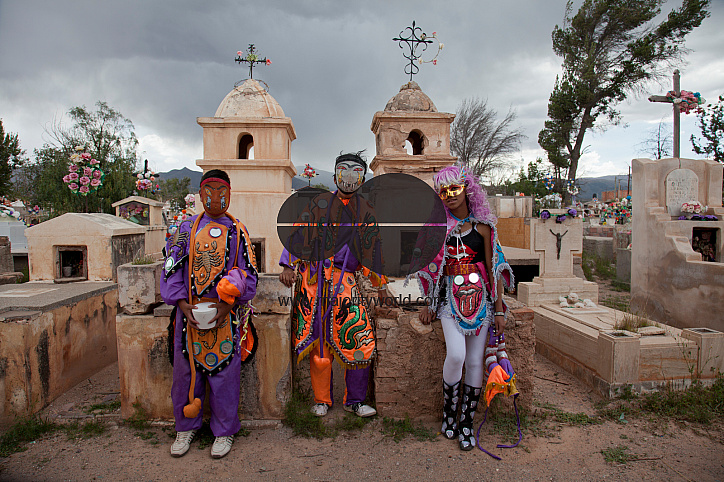 Young people in traditional costumes at a cemetery during Carnival in Humahuaca,  Jujuy province in the Andes region of Argentina, South America