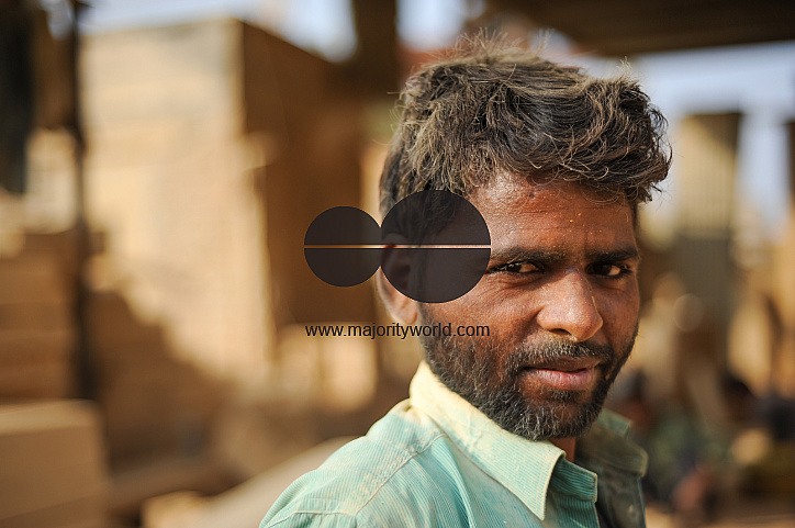  Portrait of a worker in a sandstone workshop.