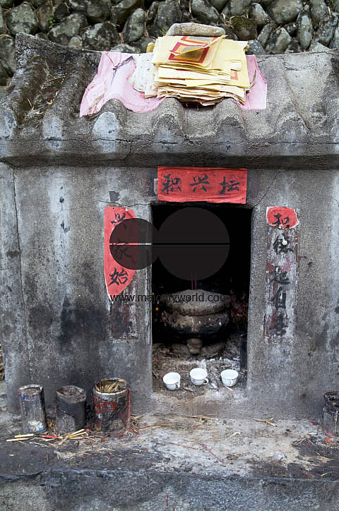 CHINA Altar to ancestors with tea cups in in a village in the tea growing region  in Fujian province.