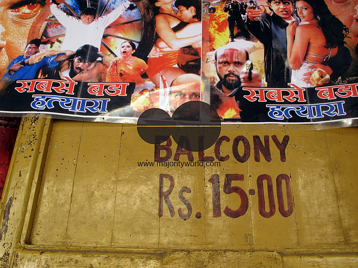 INDIA.Film posters outside an old picture house in Mumbai.
