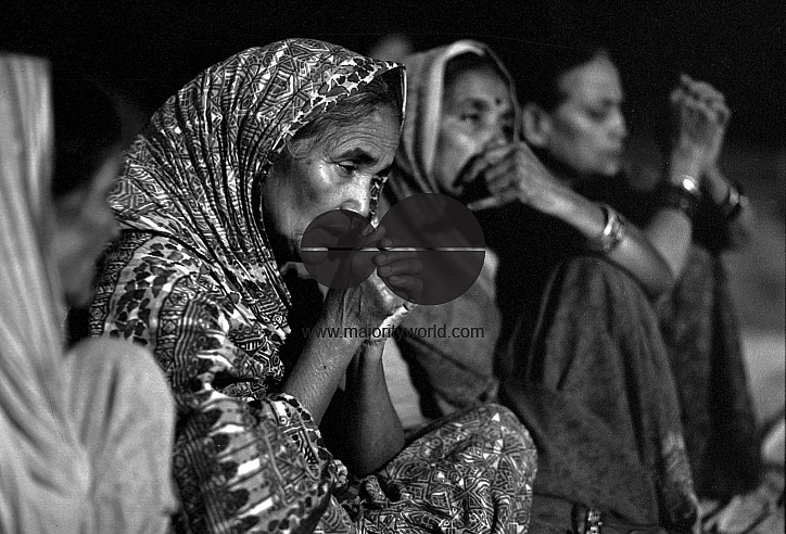 Women praying on the Ganga River..