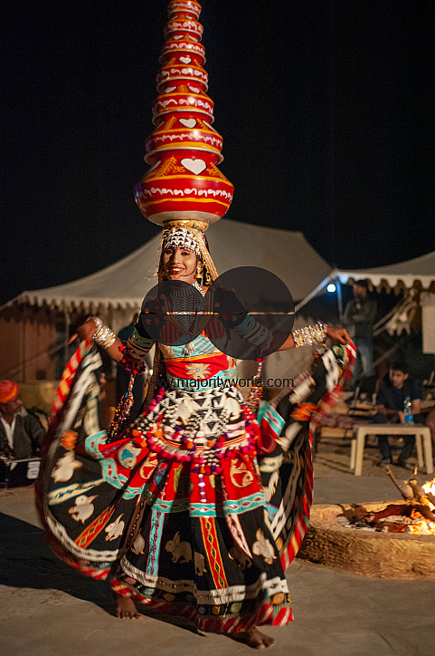  A dancer performing for tourists who camp in the desert.