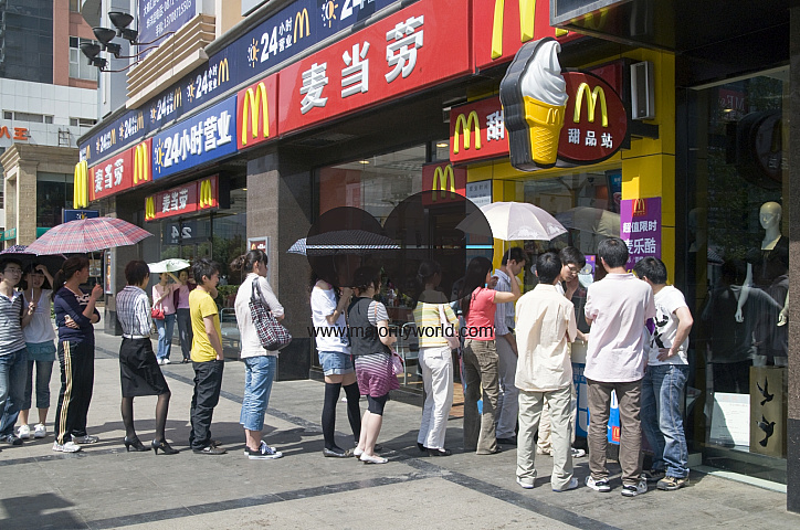 CHINA Local people waiting outside a Mac Donald's fast food restaurant in Guangzhou, Guangdong province.