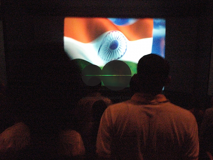 INDIA.Singing the Indian national anthem before the projection of a film at the Regal Cinema in Mumbai.