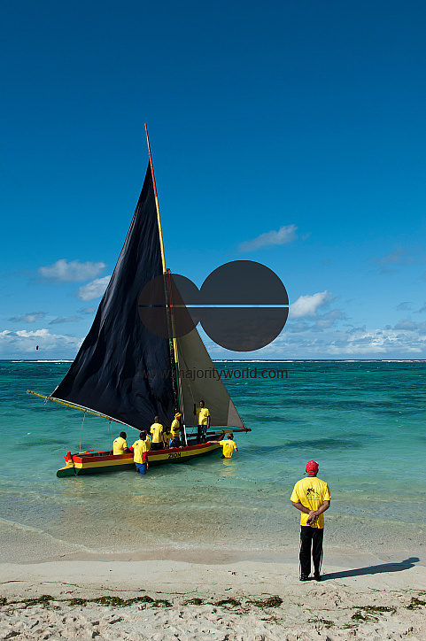 Mauritius. Preparing for a Sunday pirogue regatta.