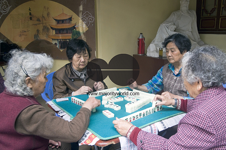 CHINA Elderly women playing mahjong in a park in Kunming, Yunnan province..
