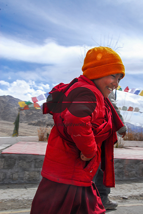 A young monk smiling near the Thiksey Monastery, Ladakh.