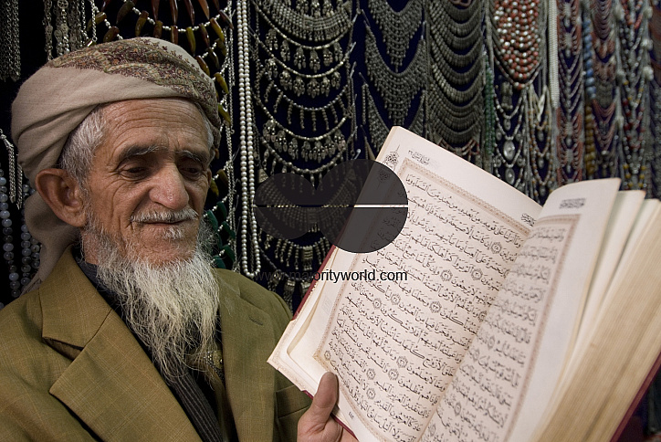 Yemen. Man reading his Koran in his shop. Old City. San'a'.