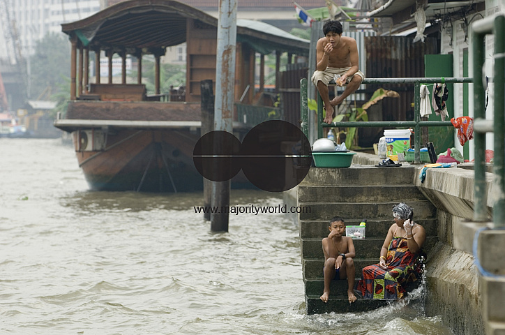 Thailand. Bathing in the Chao Phraya river, Bangkok.