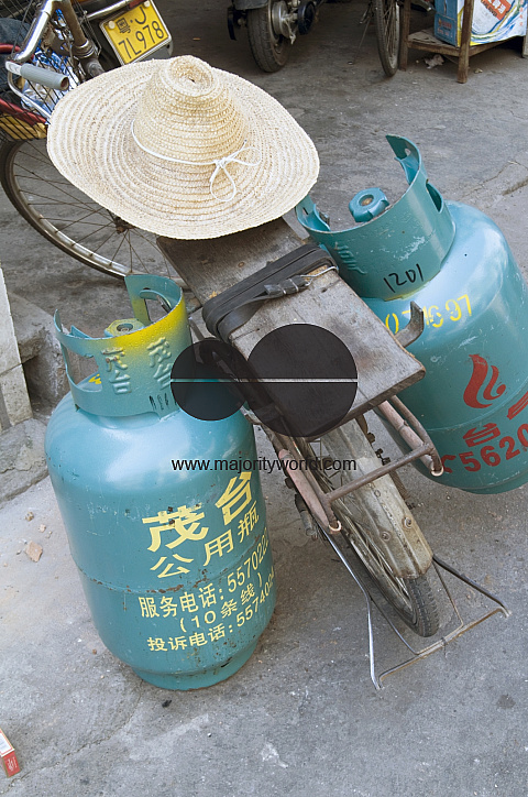 CHINA Migrant workers from the countryside working as self-employed street vendors of gas cylinders in Guangzhou, Guangdong province.