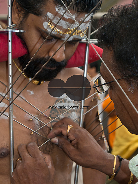 Thaipusam Hindu Tamil festival in Singapore. Devotees have their bodies pierced with skewers