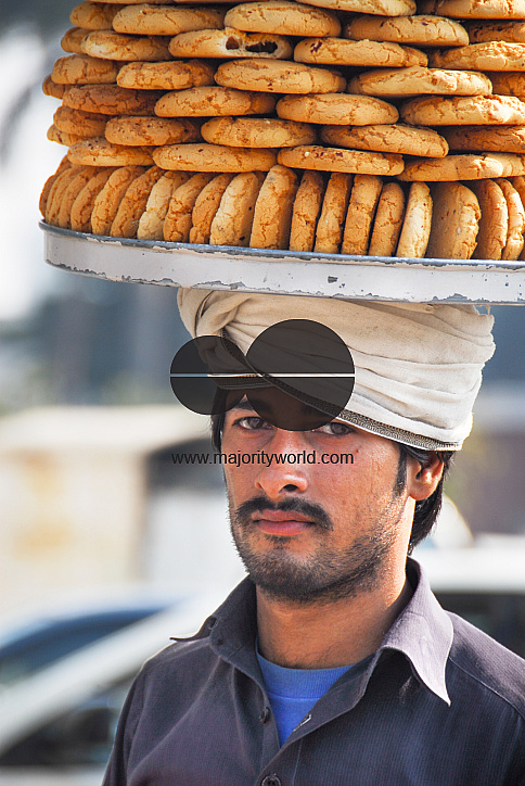  A man selling cookies, Lahore.