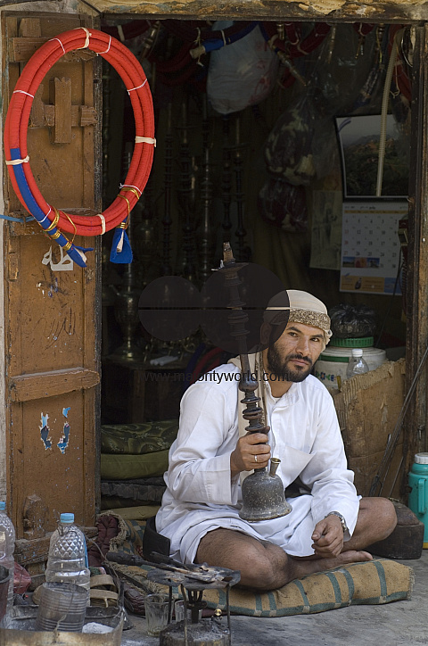 Yemen. The old Souk, shop repairing & selling water pipes.