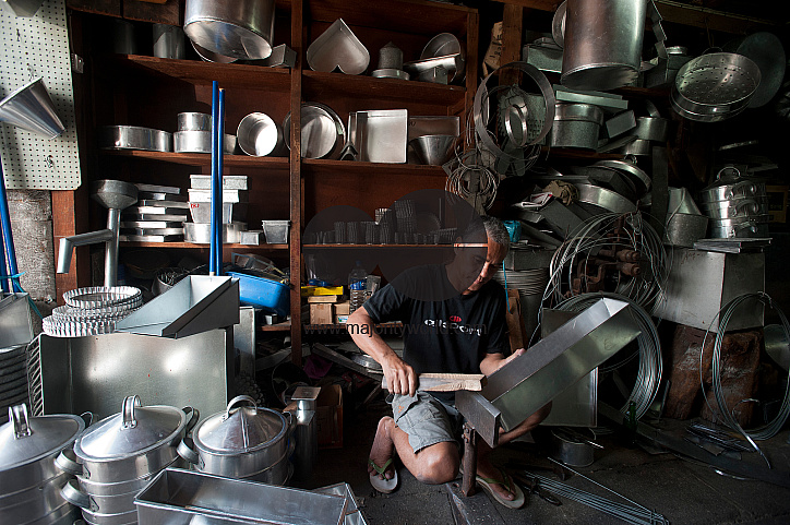 Mauritius. Alain, panel beater. In his workshop on Rue Pasteur in China Town.