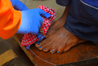 Cleaning the feet of safari workers (Cleaning Staff)