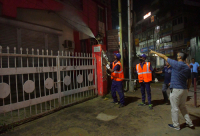 Workers Spray Disinfectant to Contain Coronavirus