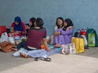 Migrant domestic workers enjoy a day off by the Bay side in Singapore