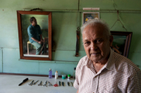 Mauritius. Mr. Gopaul, barber, in his salon. Mahebourg.