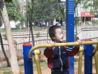CHINA Boy exercising in a park in Kunming, Yunnan province..