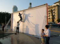 CHINA  Migrant workers from the coutryside putting up an stage at Xiamen seafront promenade in Fujian province.