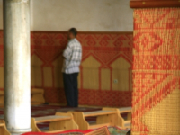 A man reading from the Quran in a mosque in Fez, Morocco. October 2, 2006.